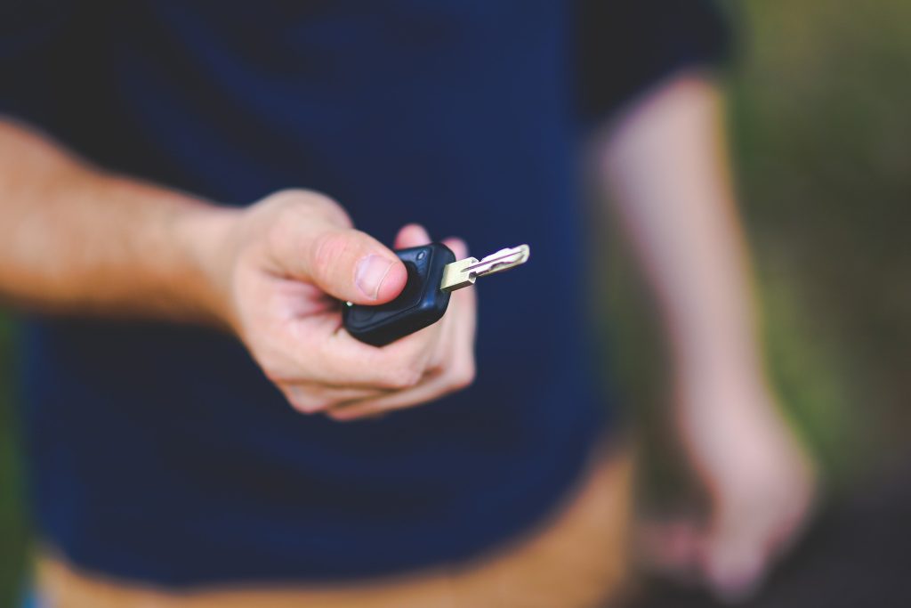 man-holding-car-keys